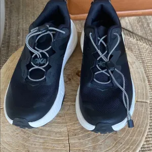 Hoka women’s Black Transport shoes