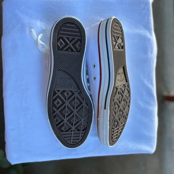 Man and woman, converse sneaker shoes. Men’s size 7, women’s size
