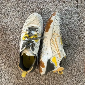 Men’s White and Yellow Nike Sneakers