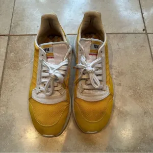 Men’s Adidas ZX 500 RM shoes in yellow.