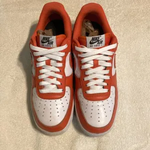 Nike Air Force1 orange and white shoes. Size men’s 8/1/2.
