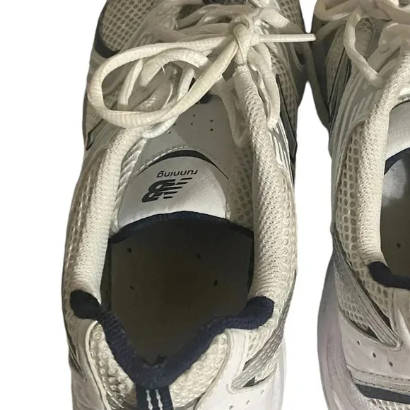 Size 7.5 Men’s New Balance color White silver sneaker WL574G02. Shoes