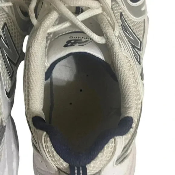 Size 7.5 Men’s New Balance color White silver sneaker WL574G02. Shoes