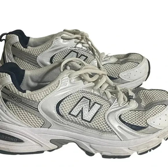 Size 7.5 Men’s New Balance color White silver sneaker WL574G02. Shoes