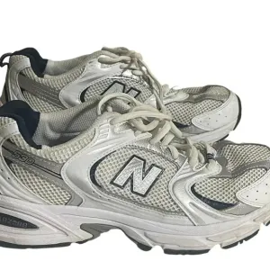 Size 7.5 Men’s New Balance color White silver sneaker WL574G02. Shoes