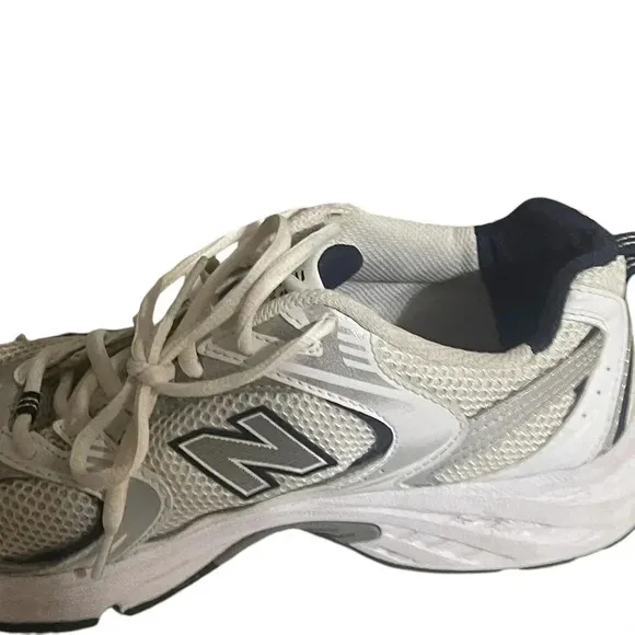 Size 7.5 Men’s New Balance color White silver sneaker WL574G02. Shoes