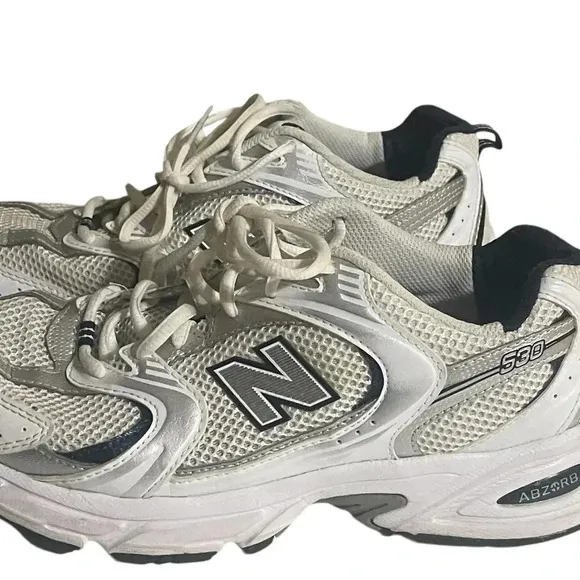 Size 7.5 Men’s New Balance color White silver sneaker WL574G02. Shoes