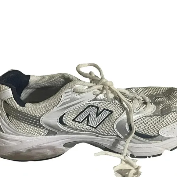 Size 7.5 Men’s New Balance color White silver sneaker WL574G02. Shoes