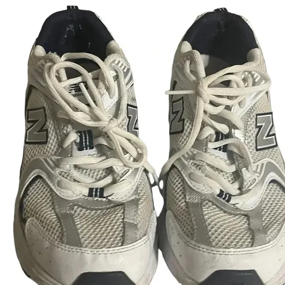 Size 7.5 Men’s New Balance color White silver sneaker WL574G02. Shoes
