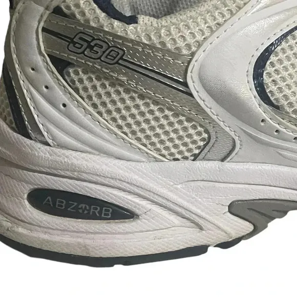 Size 7.5 Men’s New Balance color White silver sneaker WL574G02. Shoes
