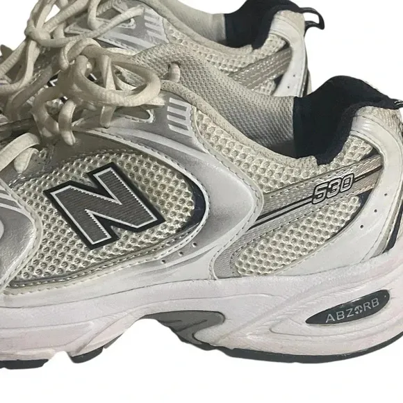 Size 7.5 Men’s New Balance color White silver sneaker WL574G02. Shoes