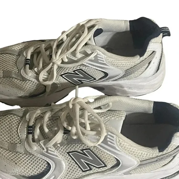 Size 7.5 Men’s New Balance color White silver sneaker WL574G02. Shoes