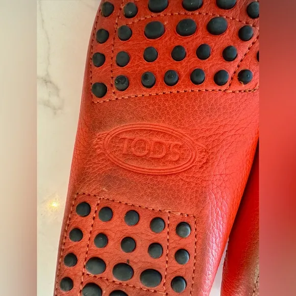 Tod’s Women’s Gommino Driving Shoes in Orange. Size 38EU/8US