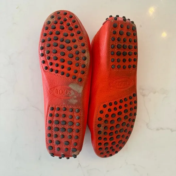 Tod’s Women’s Gommino Driving Shoes in Orange. Size 38EU/8US