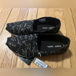 TOMS Black Dinosaur Print Slip-On Shoes Women’s Glow in the Dark 8.5